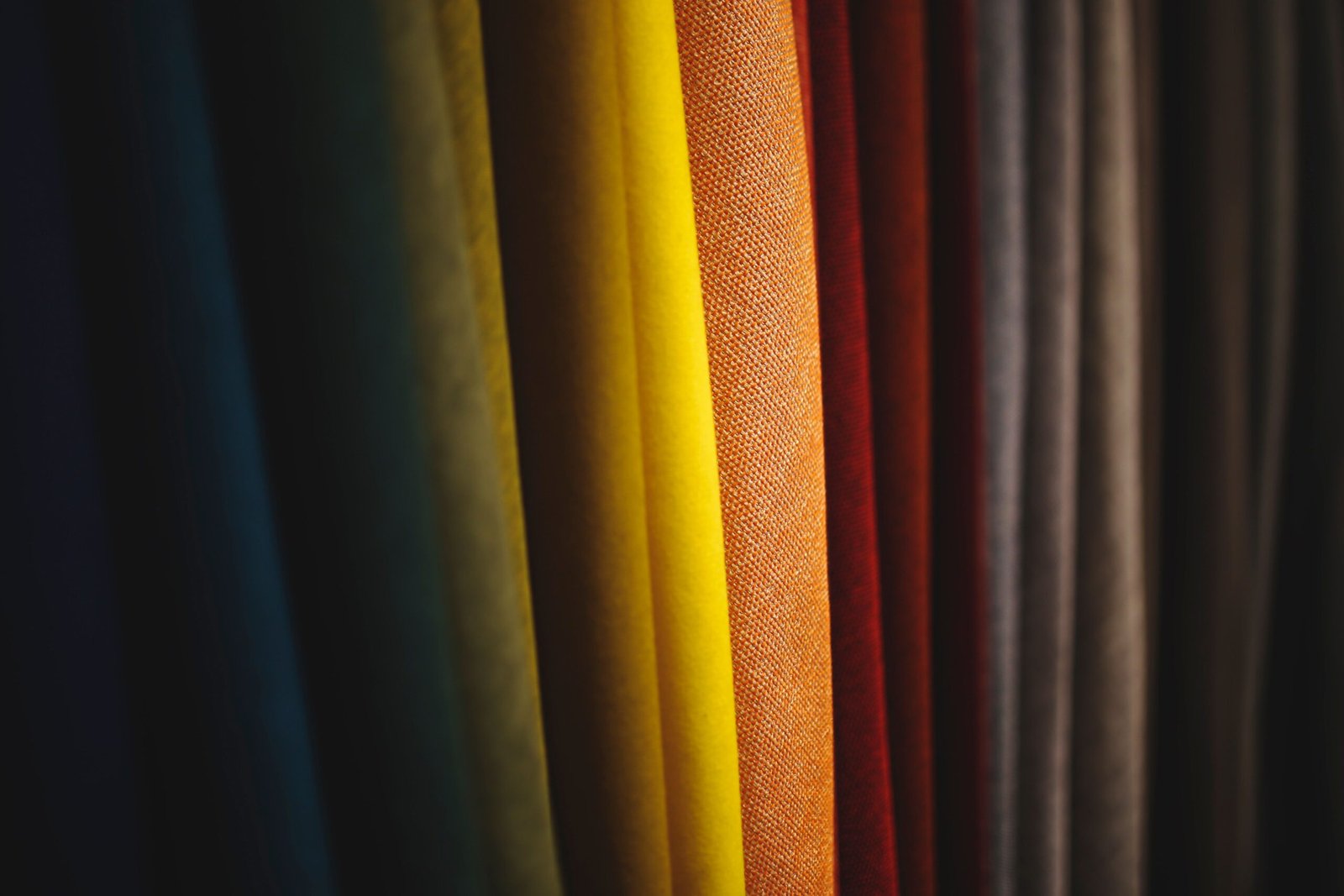 fashion red yellow designer 5872 5872 A close-up view of colorful fabric showcasing diverse textures and vibrant folds.