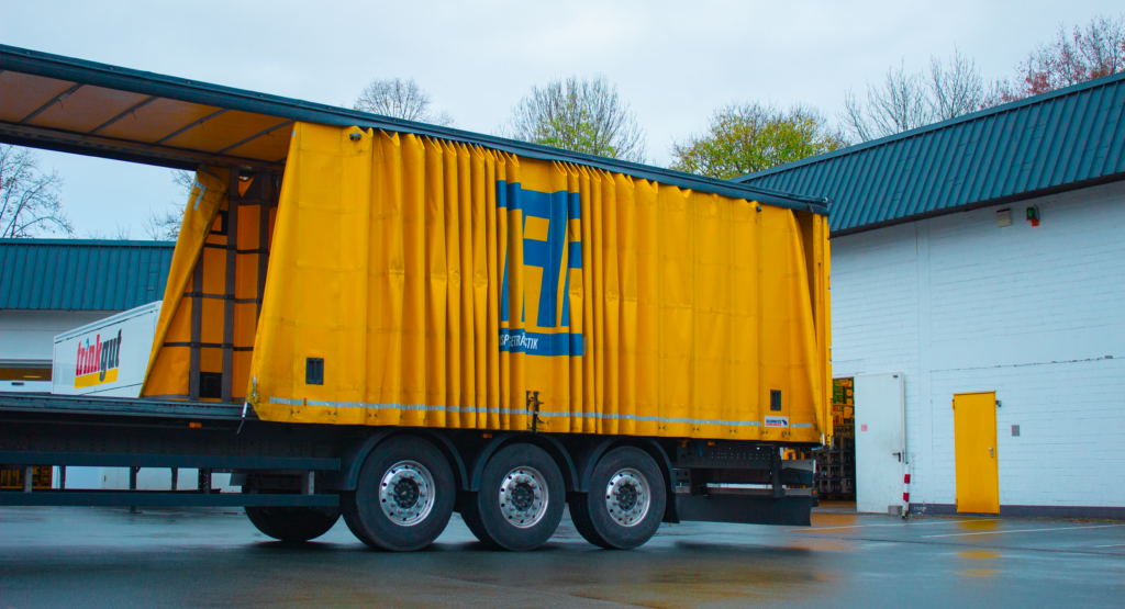 pexels photo 18034869 18034869 Yellow cargo truck in an industrial setting, Essen, Germany.